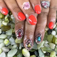 Telling stories one nail at a time. This adorable hand-painted design features little doodles with sparkling dresses, bringing a touch of whimsy and personality to the manicure.