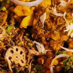A close-up of the textures and ingredients in our relish munch basket, including lotus stem, chickpeas, and fresh herbs.