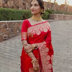 For this beautiful Bengali bride, we embraced tradition with a classic red Benarasi saree. The makeup was kept soft and radiant, with defined eyes and a traditional bindi, letting her natural grace be the focus.