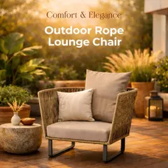 A perfect example of comfort meeting elegance. This is our outdoor rope lounge chair, set against a beautifully landscaped backdrop. Notice the intricate rope weaving and the plush, deep cushions, which create an inviting spot to relax. The sturdy aluminum frame ensures it's as durable as it is stylish, ideal for any modern patio design.
