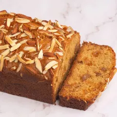 This is our almond and fruit travel cake. It's a moist loaf studded with dried fruits and topped with sliced almonds for a wonderful texture.