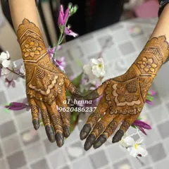 The same elegant floral design, shown with both hands together to highlight its symmetry.