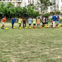 Lined up and ready to go. A typical morning starts with ball mastery drills, ensuring every player gets hundreds of touches on the ball to build confidence and control.