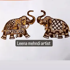 A pair of royal elephants, intricately decorated. These majestic figures are a popular choice for bridal mehndi, symbolizing strength and prosperity.