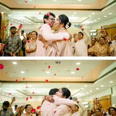 A moment of pure celebration as the couple hugs after their intimate 'Two-States' wedding ceremony, showered with rose petals by their loved ones.