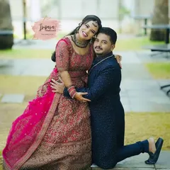 A joyful moment between the bride and groom at their reception. I created a glamorous yet elegant look for the bride's lehenga, focusing on makeup that shines in photos and lasts through a night of celebration.