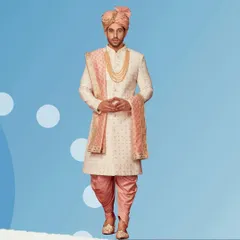 The complete royal groom attire. This outfit features a beautifully embroidered sherwani, dhoti-style pants, a matching safa, and traditional jewelry, all available for rent.
