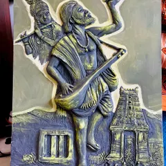 Another view of the finished Kanaka Dasa clay mural, showing how light and shadow play on the sculpted surfaces to create a dynamic effect.