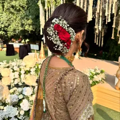Another view of this stunning floral hair bun. It is the perfect accessory for a traditional day wedding look.