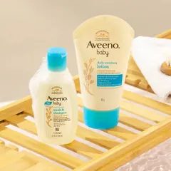 A close-up lifestyle shot of baby care products on a bath caddy. We created a gentle, bubbly bath setting to communicate the product's mildness and suitability for a baby's bath time routine.