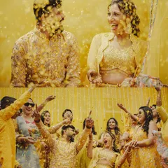 The pure, uninhibited joy of a Haldi ceremony. We capture the fun and candid moments as the couple is showered with flower petals by their loved ones, creating a memory full of laughter and color.