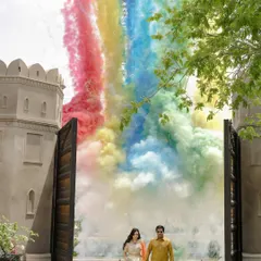 A grand, colorful entrance at a Jaipur palace. Using rainbow smoke bombs, we create vibrant and energetic pre-wedding photos that are perfect for celebrating your love out loud.