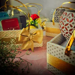 A closer look at the details in the friendship gift baskets, including a small artificial rose and a beautiful bow. It's these little touches that make a gift feel special.