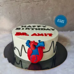 A cake for a cardiologist, the one who keeps our hearts ticking. This design features a fondant anatomical heart and an EKG heartbeat line, a sweet and clever tribute to a doctor's life-saving work.