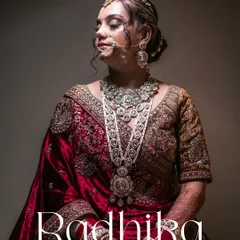 A quiet moment of reflection for the bride, Radhika, in her stunning North Indian bridal attire. We use dramatic lighting to highlight the intricate details of her jewelry and the rich velvet of her lehenga, creating a timeless and elegant bridal portrait.