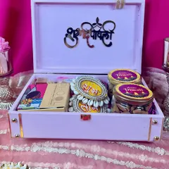 Here’s what’s inside our pink Diwali trunk! We’ve filled it with jars of delicious dry fruits, traditional 'shubh labh' hangings, and other festive treats, all nestled beautifully with a 'Shubh Deepawali' message.