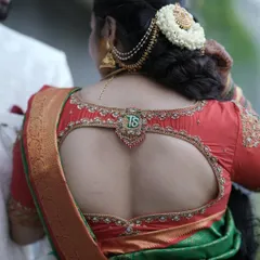 The full view of the blouse back, showing the personalized tassel as a central design element.