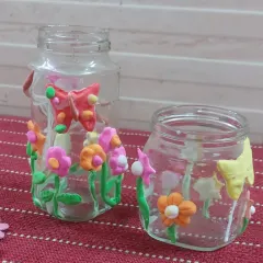 These beautiful floral jars were made by the kids during our Spring Workshop. It's a wonderful way to upcycle old jars and bring a bit of spring indoors.
