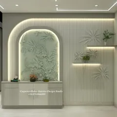 A stunning feature wall with a 3D bas-relief sculpture of tropical leaves. The design is organic, artistic, and brings a touch of nature indoors.