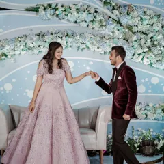 Another shot of the couple on their engagement stage. The groom is leading his bride, and she looks absolutely radiant.