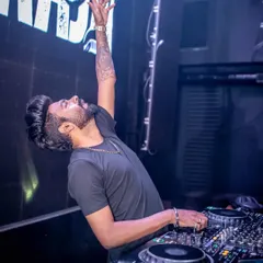 A classic DJ pose at SinQ Nightclub, lost in the music. This is my signature move when the energy is peaking.