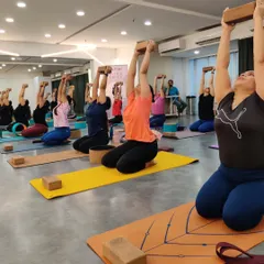 Participants in our workshop use blocks to find lift and extension in their upper body. This foundational work is key to preparing the spine for deeper, safer backbends.