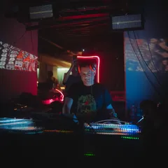 A close-up from a set at the Aftermath weekender. The focus here is on the connection with the gear, with projections adding another layer to the visual experience.