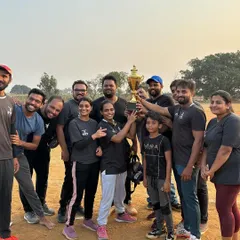 The winning team celebrating with the trophy. Our cricket league is a highlight of the year, bringing everyone together for some friendly competition.