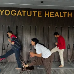 Using a chair for a supported hamstring stretch. This modification makes the pose accessible for those with tight hamstrings or back issues, ensuring the spine remains long.