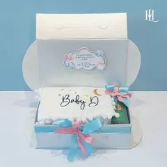 Celebrate the journey to parenthood with this 'Touch of Heaven' hamper. The cloud-shaped box opens to reveal a personalized pillow and other essentials for the parents-to-be.