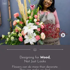 This student proudly displays her powerful arrangement, a testament to designing for mood, not just looks. The combination of lilies, roses, and pampas grass creates a feeling of dramatic elegance.