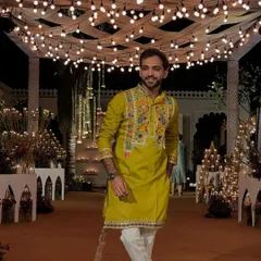 A candid shot in a green kurta under beautiful lighting. I always try to bring my own style and a bit of humor to every event.