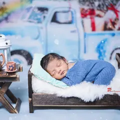 A tiny piece of heaven, sleeping so peacefully. I use miniature props like this little bed to create adorable and classic newborn portraits.
