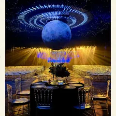 A sangeet night under a different kind of moon. For this celestial-themed celebration, I suspended a hyper-realistic moon over the venue, with lighting that mimicked a galaxy. This is how I transform a space, creating a central, gravity-defying statement piece that becomes the heart of the event's narrative.