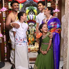 Festivals are a time for family. Here we are, sharing a joyful moment during our Varamahalakshmi celebrations. I believe in involving the entire family to create lasting memories and pass on our traditions.