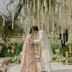 A gentle kiss after the Jaimala ceremony. It's these quiet, intimate moments amidst the grand celebration that we cherish.