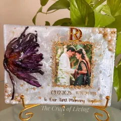 This piece holds a very special story. The lotus was a gift from a fiancé, and I preserved it along with their photo and the exact date and time of their first memory together. It's a timeless reminder of love and new beginnings.