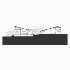 A cross-section of the community hall, showing how the building is split into two parts connected by a central courtyard. The sloping roofs are designed for rainwater harvesting and to create a human scale for the courtyard space.