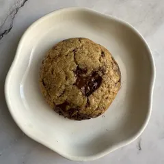 Golden edges, a gooey center, perfection. This is my classic Chocolate Chip Cookie, with a heart-shaped pool of melted Belgian chocolate.