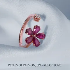 Petals of passion, sparkle of love. This open ring features a flower crafted from pear-shaped rubies, with a single diamond opposite it. The rose gold setting adds to its warmth and romance.