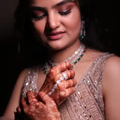 A detailed shot of the engagement makeup. The focus is on the shimmery, bronze eyeshadow and the flawless, dewy skin that looks incredible up close.