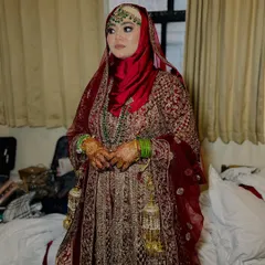 A full-length view of the Hijabi bride, showing how the entire look, from the makeup to the hijab and the lehenga, comes together to create a stunning silhouette.