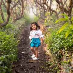 Walking through a magical, tree-lined path, this little explorer is completely in her element. My goal is to create a space where children feel free to be themselves, resulting in natural and enchanting portraits.