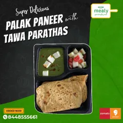 A healthy and classic choice, our Palak Paneer with Tawa Parathas. This meal combo includes soft paneer cubes in a smooth spinach gravy, served with parathas and a side salad.