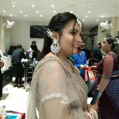 A side view of the engagement party look, showing the elegant hairstyle with a simple twist and how the makeup looks from every angle.