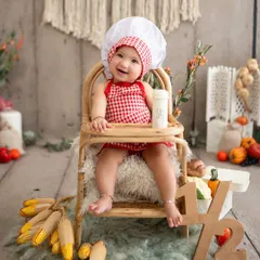 Celebrating a half-birthday in the cutest way possible! This little chef is marking six months with a fun, food-themed milestone session.