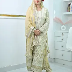 A full look at our elegant off-white sharara suit with heavy silver and gold embroidery. Perfect for a Nikah ceremony or a reception.