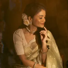 A serene, dreamy portrait of Sanjana. The choker and matching earrings add a touch of timeless grace.