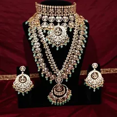 Here is a full view of one of my most requested bridal sets for rent. This magnificent Polki set features a wide choker, a matching long rani haar, and heavy chandbali earrings, all detailed with delicate mint green beads for a regal finish.