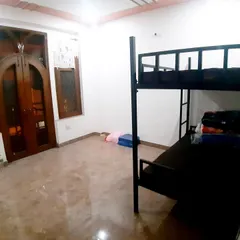 Another view of a room in the athlete hostel, showing the simple and functional living quarters provided for our residential trainees.